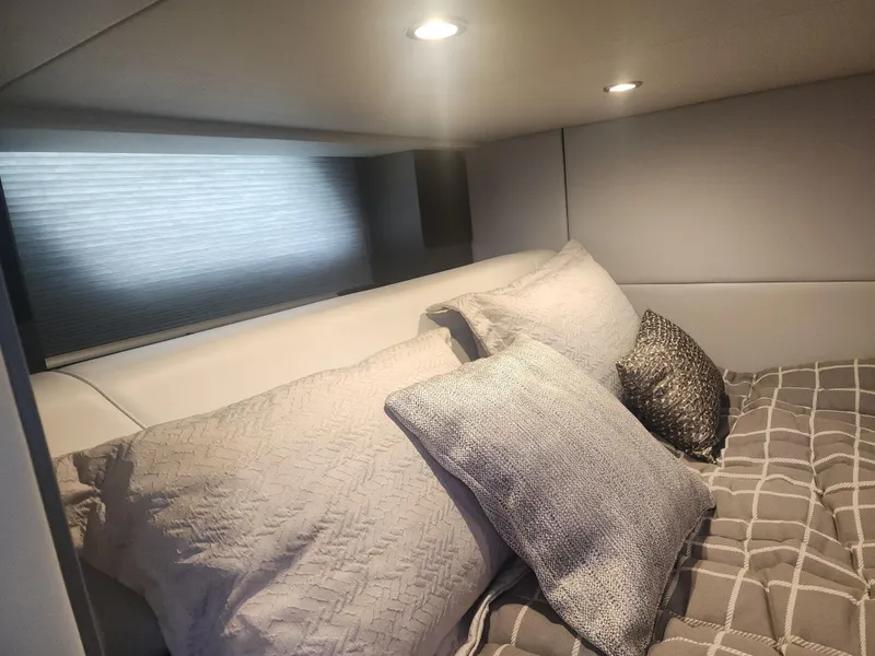 Slide: The Image of Cozy cabin interior of 2021 Formula 380 Super Sport Crossover OB with plush bedding. - 42