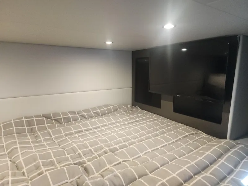 Slide: The Image of Cozy cabin interior of 2021 Formula 380 Super Sport Crossover OB with bed and TV. - 43