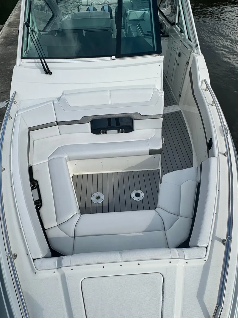 Slide: The Image of 2021 Formula 380 Super Sport Crossover OB boat interior with white seating and sleek design. - 47