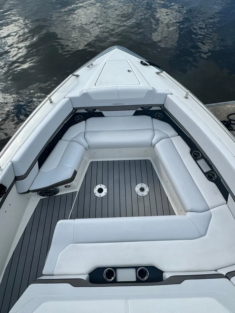 Slide: The Image of 2021 Formula 380 Super Sport Crossover OB boat with spacious seating and sleek design. - 48