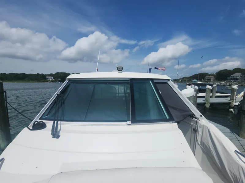 Slide: The Image of 2021 Formula 380 Super Sport Crossover OB docked by the water. - 5