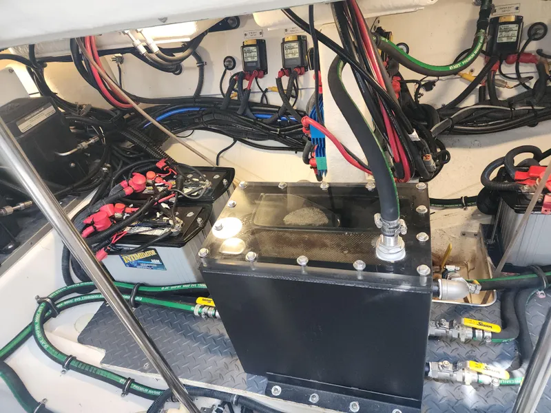 Slide: The Image of Engine compartment of 2021 Formula 380 Super Sport Crossover OB with wiring and battery setup. - 69