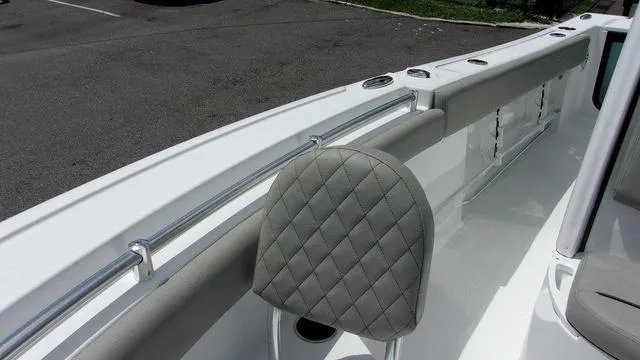 Slide: The Image of 2025 Sportsman Open 212 boat interior with quilted seat and sleek design. - 13