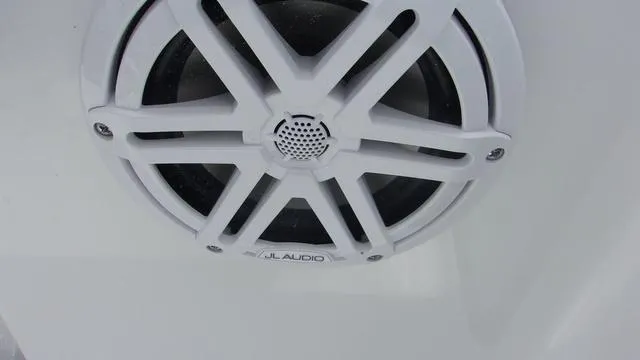 Slide: The Image of White JL Audio speaker on 2025 Sportsman Open 212 boat. - 17