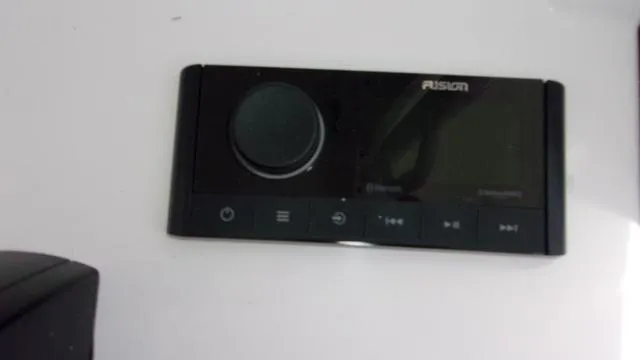 Slide: The Image of Control panel of a 2025 Sportsman Open 212 boat, featuring a sleek black design. - 18