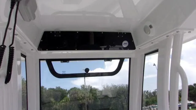 Slide: The Image of Interior view of 2025 Sportsman Open 212 boat, featuring a sleek design and modern controls. - 20