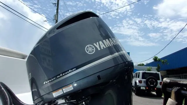 Slide: The Image of Yamaha four-stroke outboard motor on Sportsman Open 212, 2025 model, under a clear sky. - 3