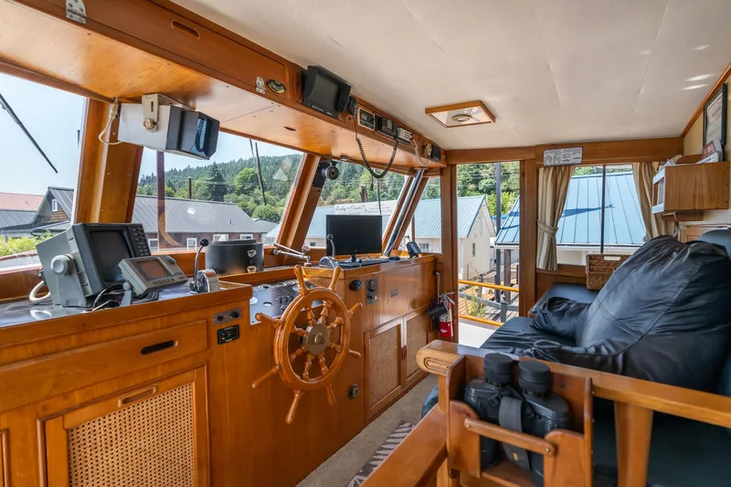 Slide: The Image of Interior of a 1976 Grand Banks 52 Europa yacht with wooden paneling. - 34