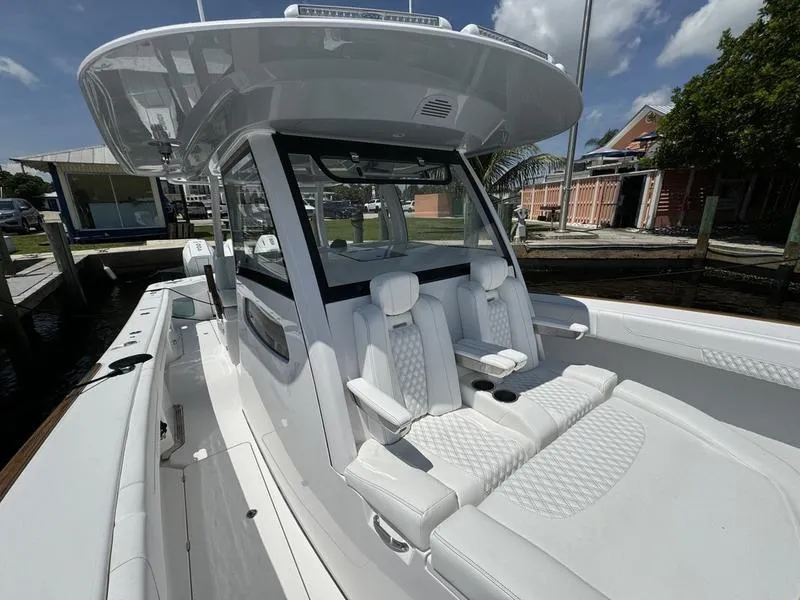 Slide: The Image of Phenom 37 boat, 2025 model, featuring luxurious white seating and sleek design. - 15