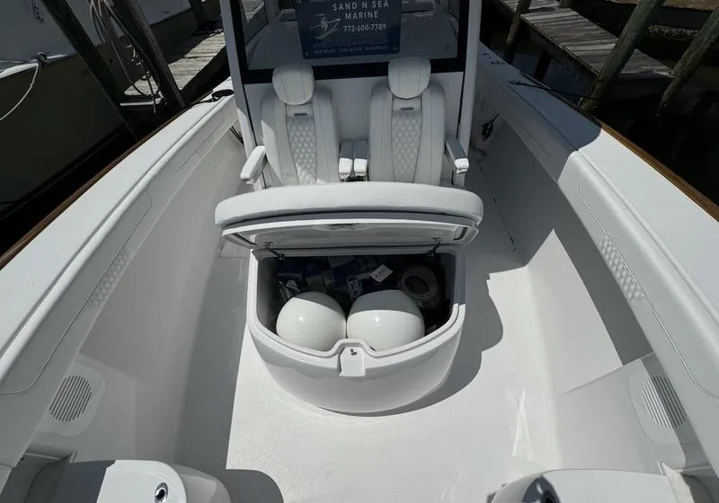 Slide: The Image of Phenom 37 boat interior with open storage compartment, 2025 model. - 16