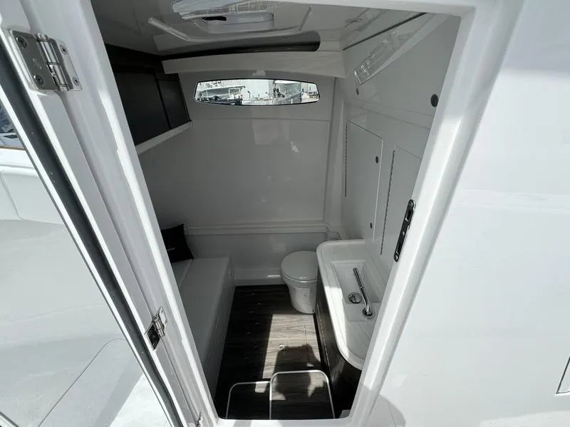 Slide: The Image of Modern bathroom interior in 2025 Phenom 37 boat, featuring sleek design and compact amenities. - 17