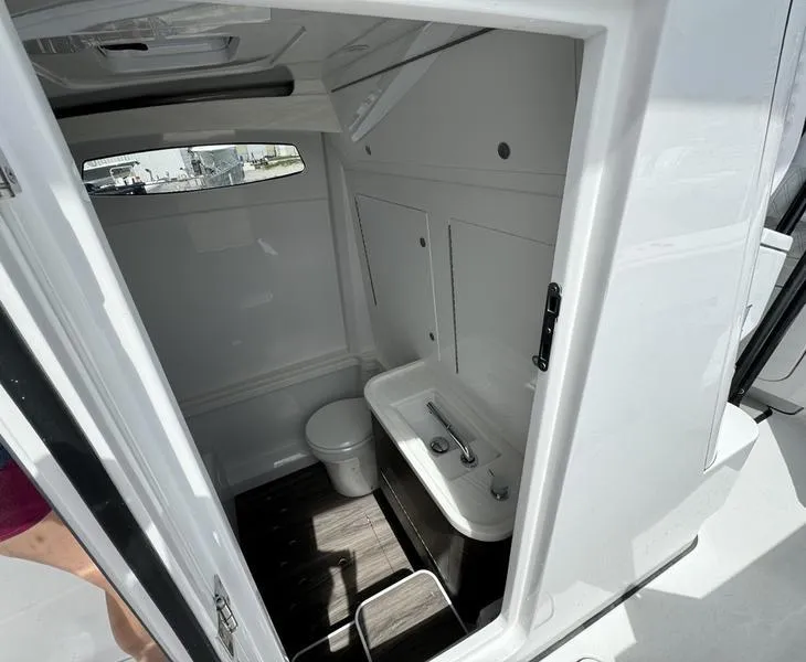 Slide: The Image of Modern bathroom interior on a 2025 Phenom 37 boat, featuring sleek design and compact amenities. - 18