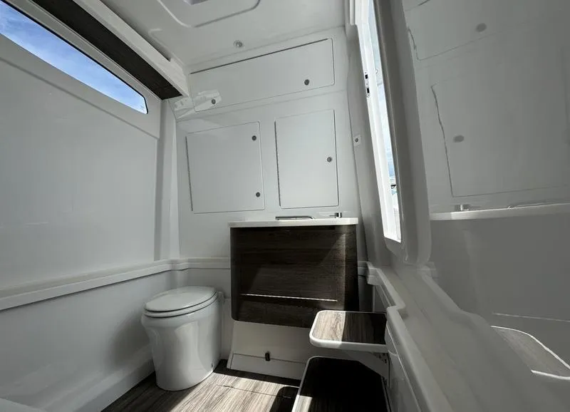 Slide: The Image of Modern RV bathroom interior in 2025 Phenom 37, featuring sleek design and ample storage. - 22