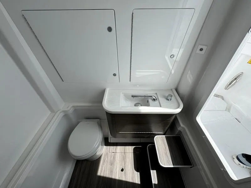 Slide: The Image of Modern bathroom in 2025 Phenom 37 with sleek sink and toilet design. - 24