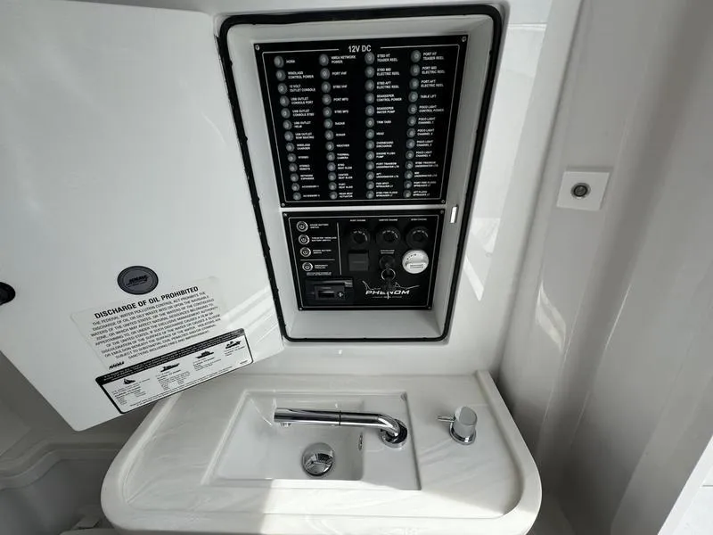 Slide: The Image of Electrical panel and sink in 2025 Phenom 37 yacht bathroom. - 27
