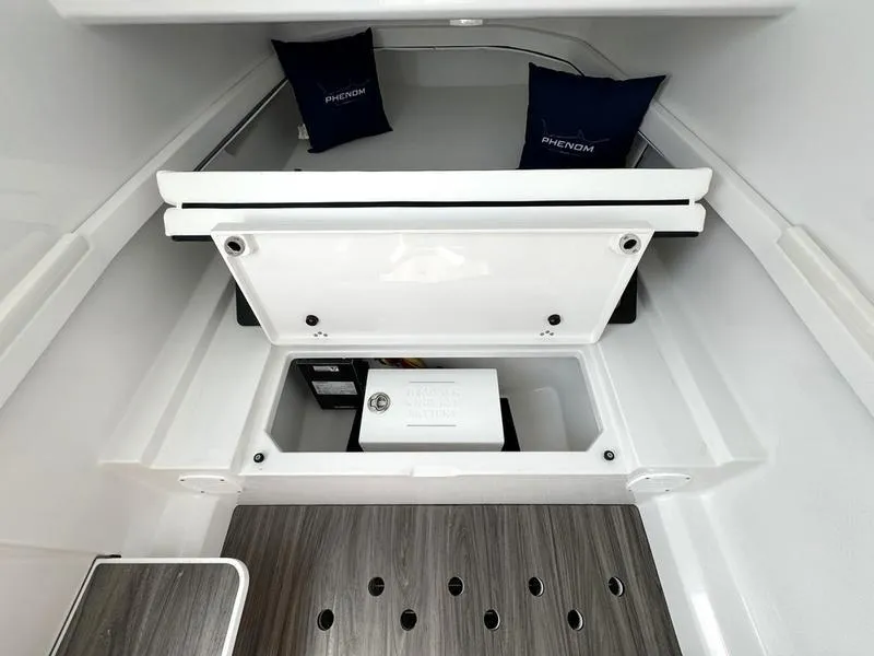 Slide: The Image of Phenom 37 cabin interior, 2025 model, featuring storage compartment and cushions. - 30