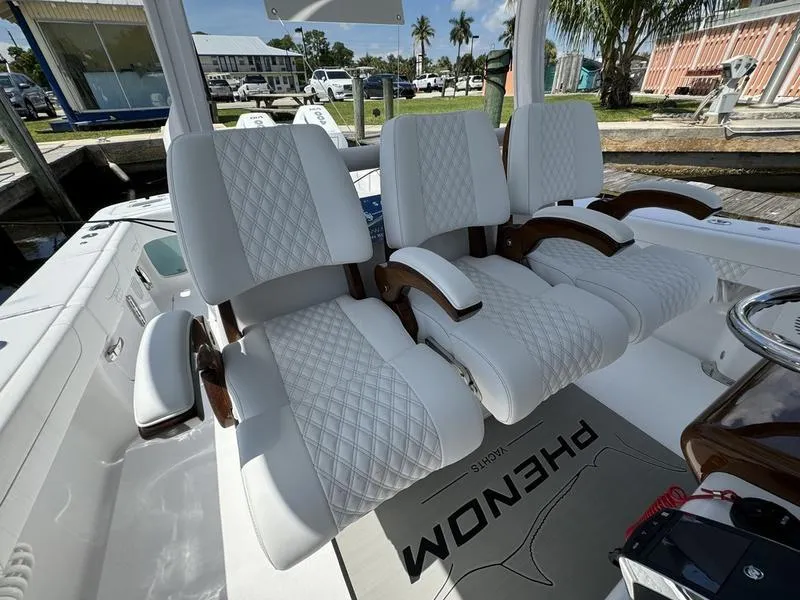 Slide: The Image of Luxurious seating on 2025 Phenom 37 boat with diamond-stitched upholstery. - 43