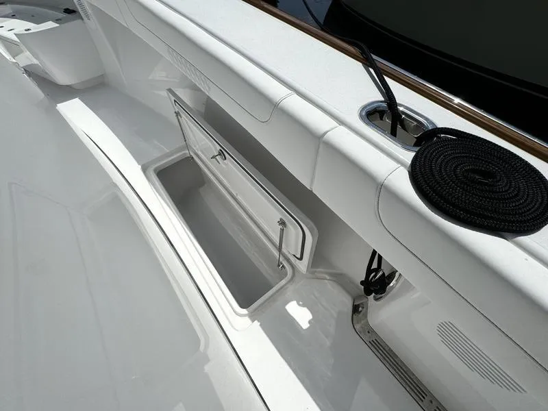 Slide: The Image of Phenom 37 boat deck with storage compartment and rope, 2025 model. - 44