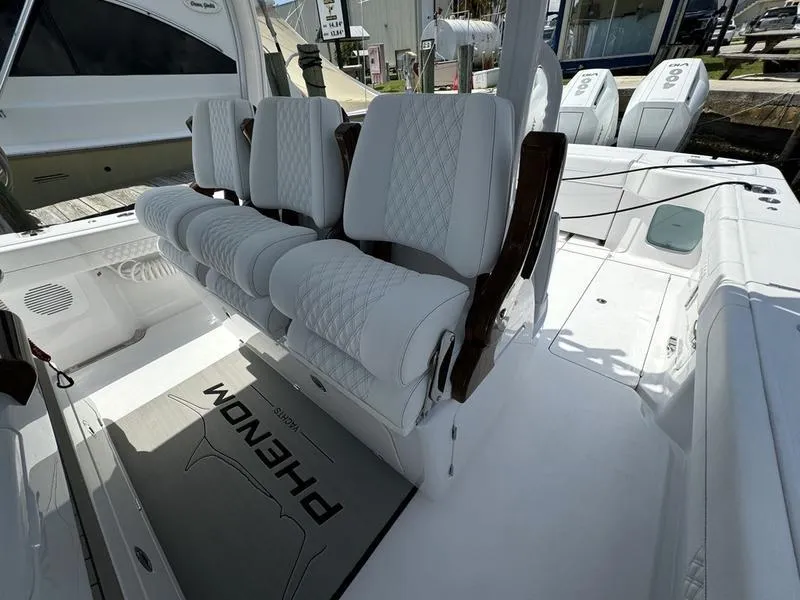 Slide: The Image of Luxurious seating on 2025 Phenom 37 boat with white quilted upholstery. - 45