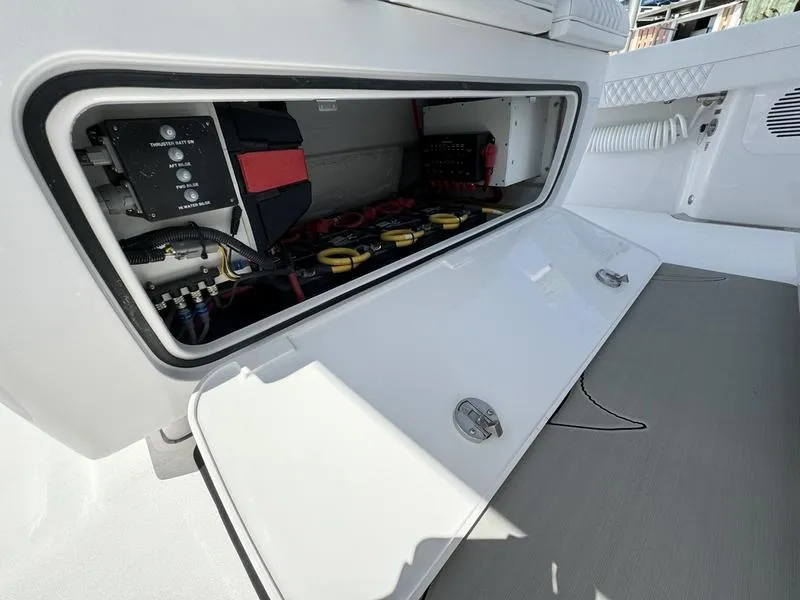 Slide: The Image of Phenom 37 boat storage compartment with electrical components, 2025 model. - 48