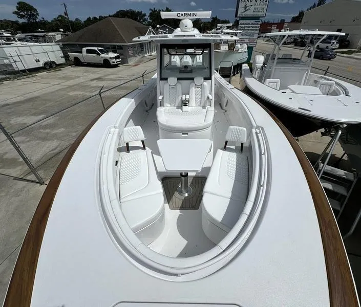 Slide: The Image of Phenom 37 boat, 2025 model, featuring spacious seating and advanced Garmin navigation system. - 9