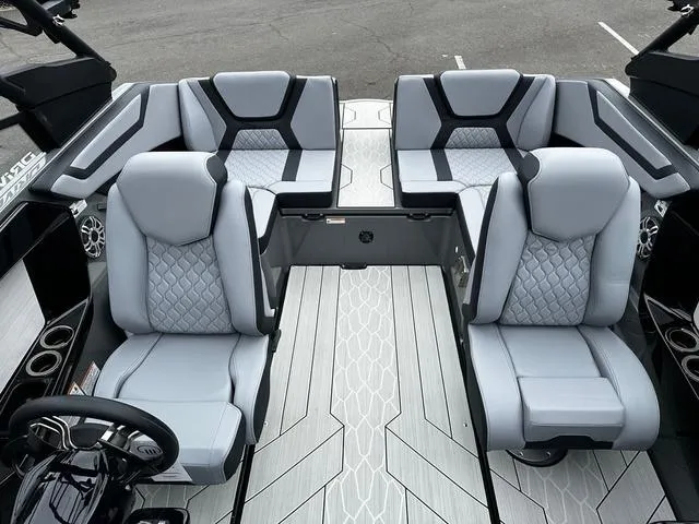 Slide: The Image of 2025 Yamaha Boats 222XD interior with modern gray seating and sleek design. - 4