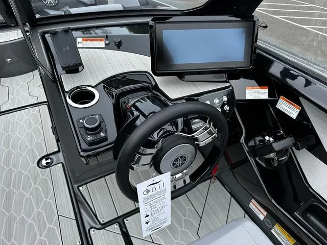 Slide: The Image of 2025 Yamaha Boats 222XD dashboard with touchscreen and steering wheel. - 7