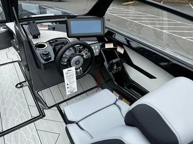 Slide: The Image of 2025 Yamaha Boats 222XD cockpit with modern dashboard and steering wheel. - 8
