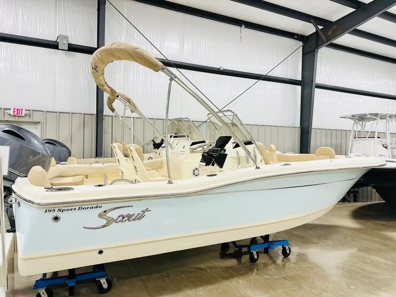 The Image of 2025 Scout 195 Sport Dorado boat in showroom, featuring sleek design and modern amenities. - 1