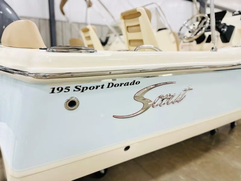 Slide: The Image of 2025 Scout 195 Sport Dorado boat, showcasing sleek design and branding details. - 11