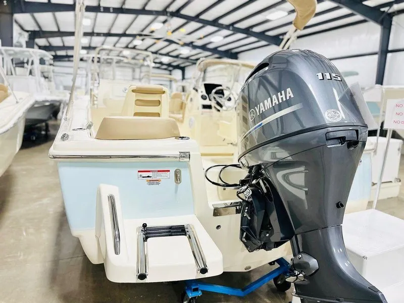 Slide: The Image of 2025 Scout 195 Sport Dorado boat with Yamaha 115 engine in showroom. - 12