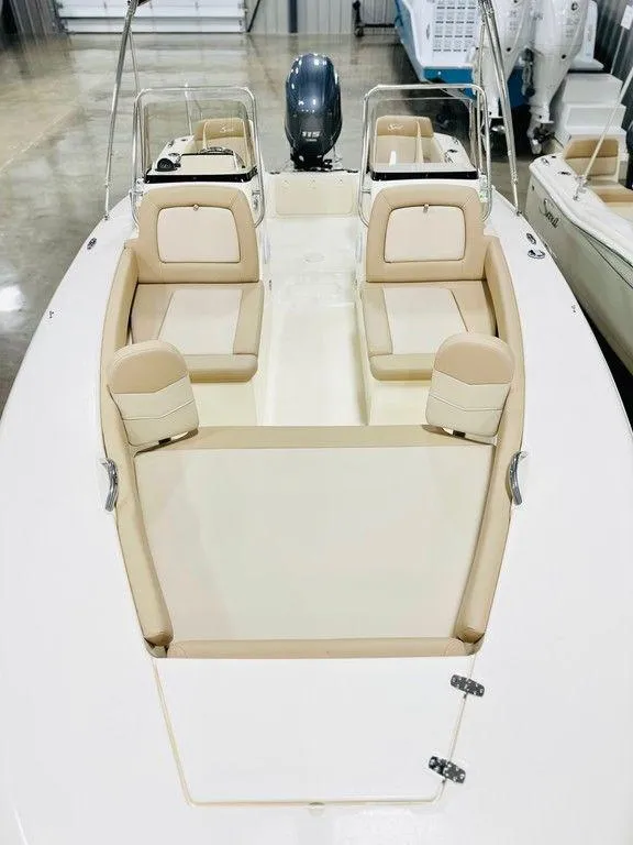 Slide: The Image of 2025 Scout 195 Sport Dorado boat interior with beige seating and modern design. - 6