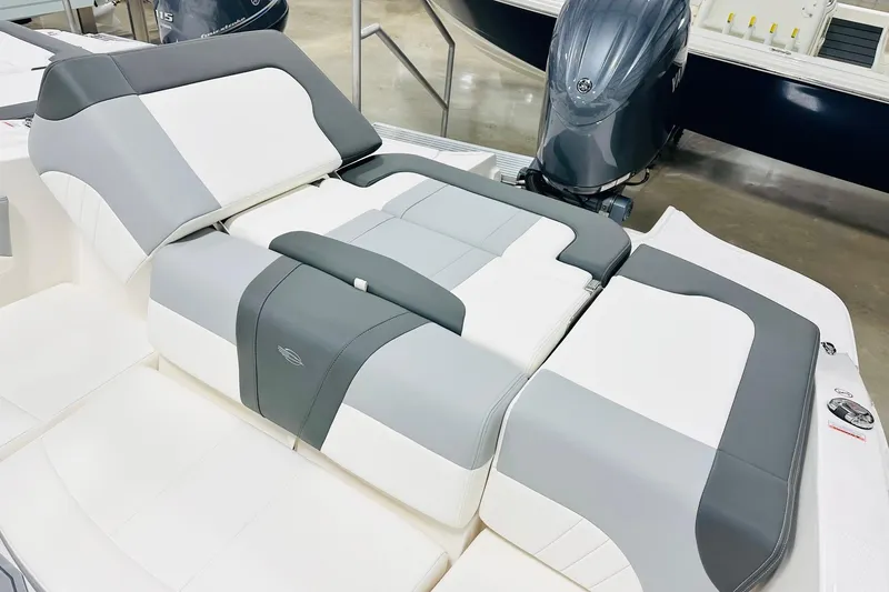 Slide: The Image of 2025 Chaparral 21 SSi OB boat interior with gray and white cushioned seating. - 12