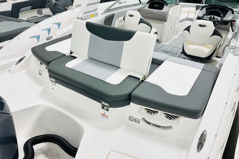 Slide: The Image of 2025 Chaparral 21 SSi OB boat interior with stylish seating and modern dashboard. - 13
