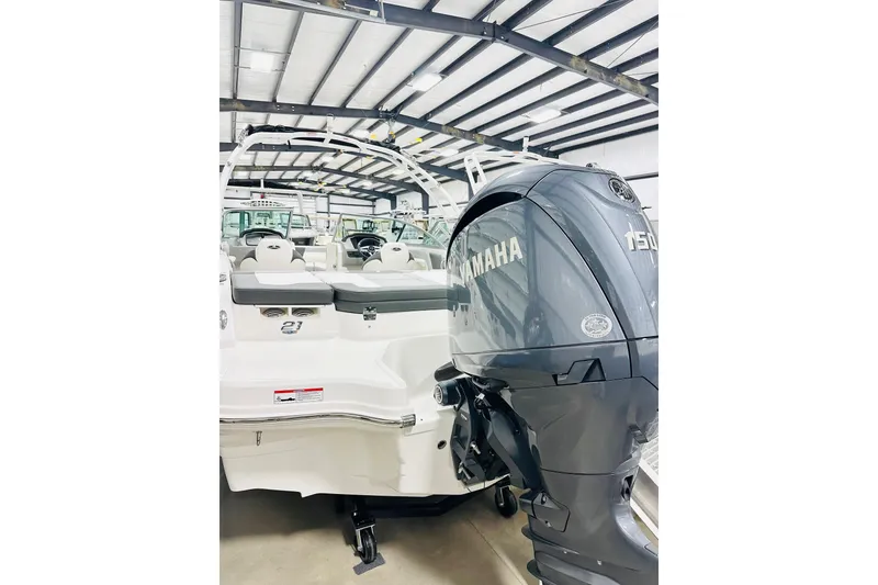 Slide: The Image of 2025 Chaparral 21 SSi OB boat with Yamaha 150 outboard motor in showroom. - 14