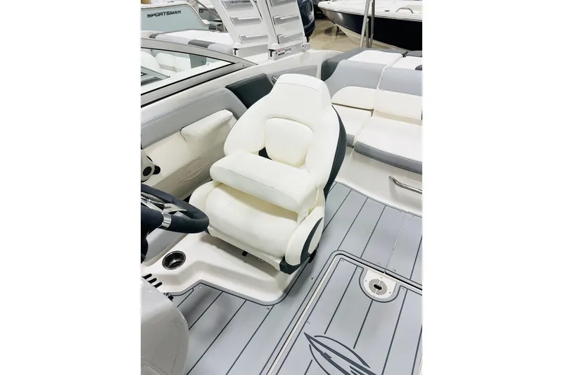 Slide: The Image of 2025 Chaparral 21 SSi OB boat interior with white seating and sleek design. - 5