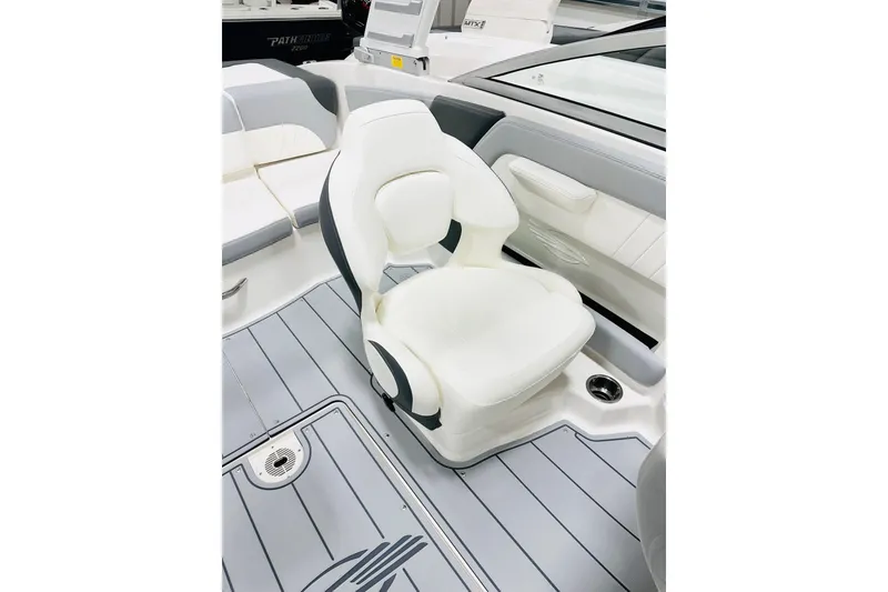 Slide: The Image of 2025 Chaparral 21 SSi OB boat interior with white seating and sleek design. - 6