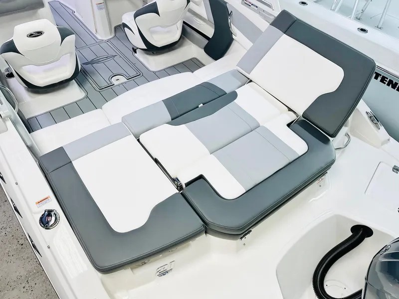 Slide: The Image of 2025 Chaparral 21 SSi OB boat interior with stylish gray and white seating. - 11