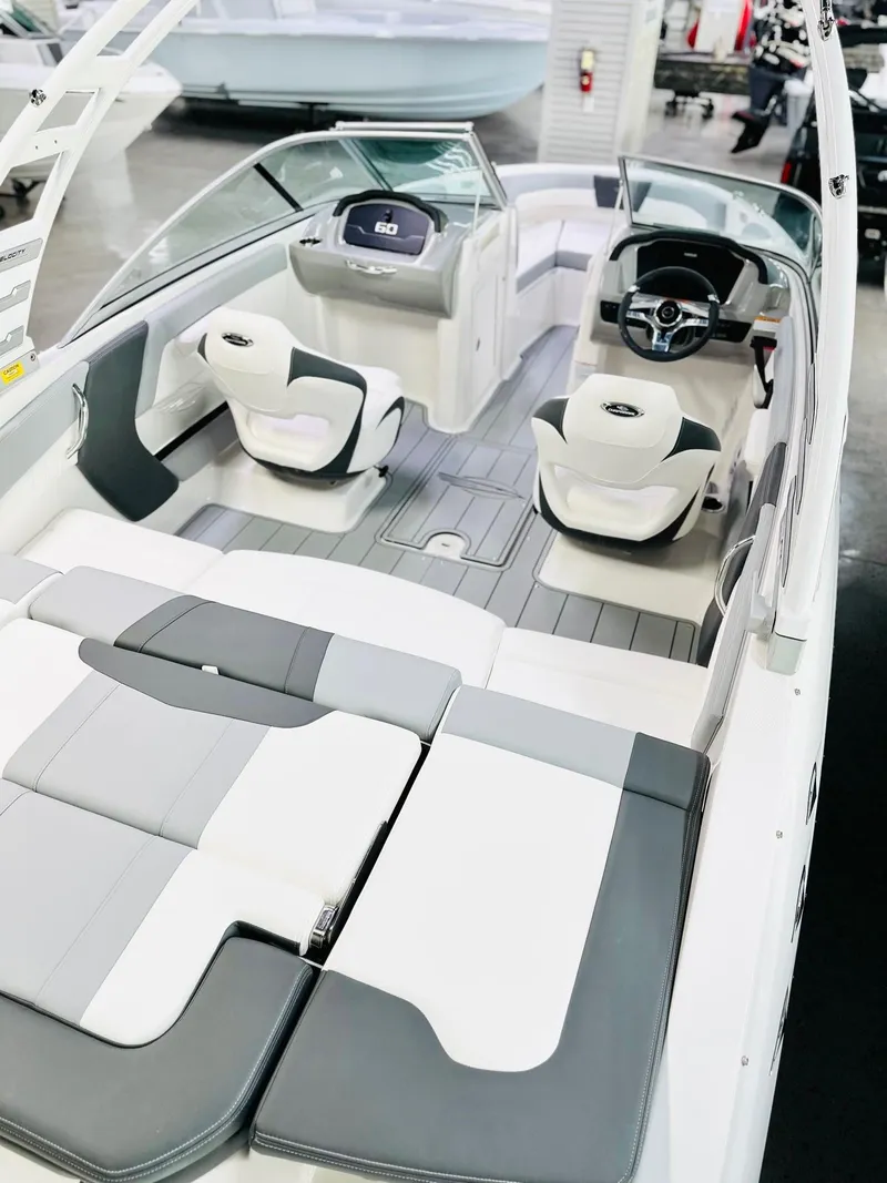 Slide: The Image of 2025 Chaparral 21 SSi OB boat interior with modern seating and sleek design. - 12