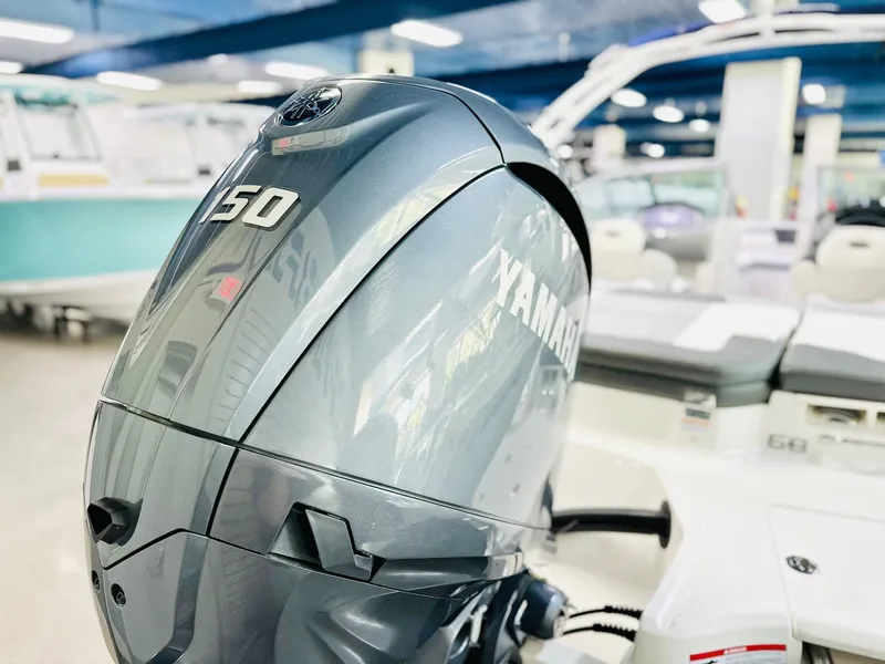 Slide: The Image of 2025 Chaparral 21 SSi OB with Yamaha 150 outboard engine in showroom. - 13