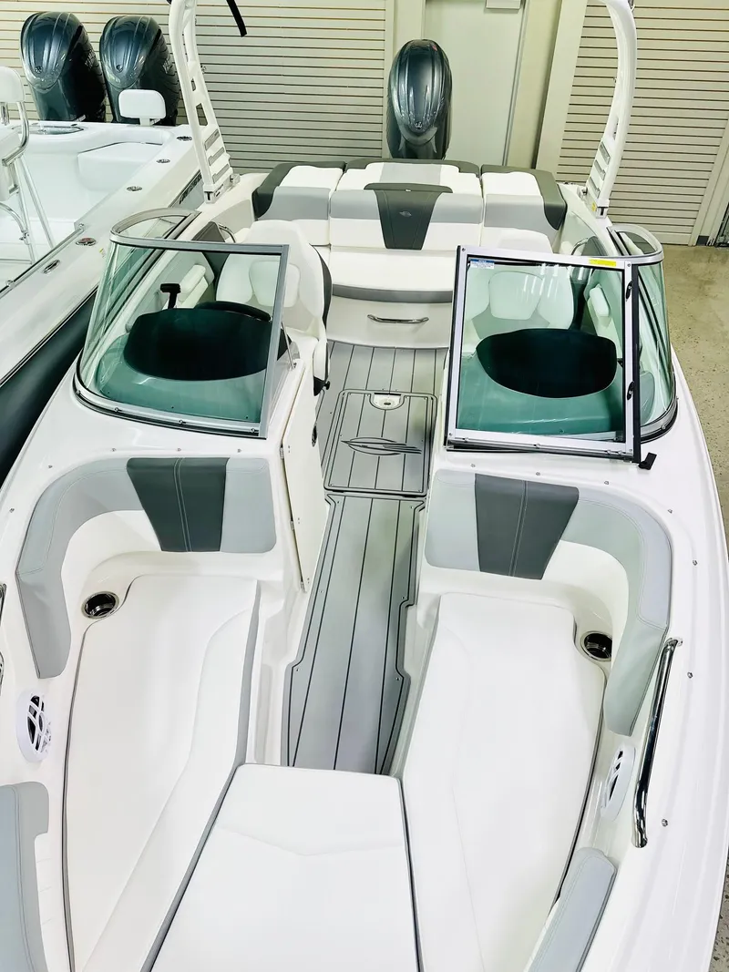 Slide: The Image of 2025 Chaparral 21 SSi OB boat interior with sleek seating and modern design. - 7