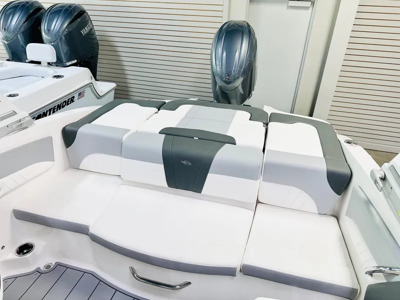 Slide: The Image of 2025 Chaparral 21 SSi OB boat interior with cushioned seating and Yamaha outboard motors. - 8