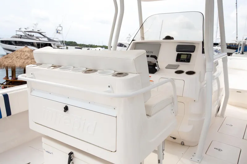 Slide: The Image of 2011 Intrepid 32 boat interior with helm and seating area. - 16