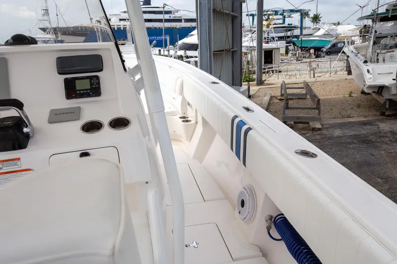 Slide: The Image of 2011 Intrepid 32 boat interior with control panel and dockside view. - 17