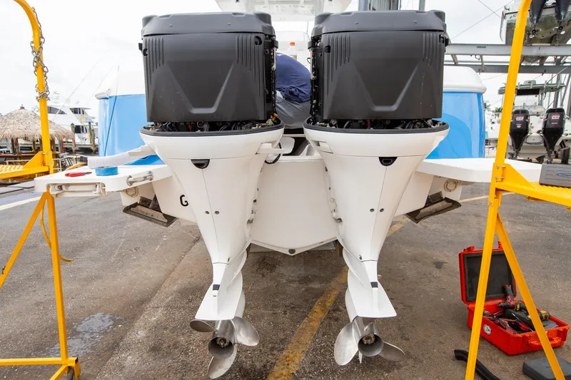 Slide: The Image of 2011 Intrepid 32 boat with dual outboard engines in a maintenance area. - 24