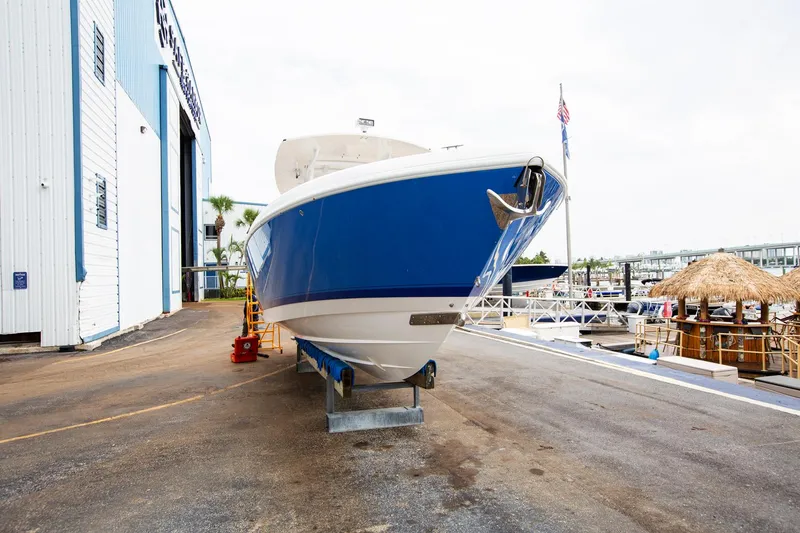 Slide: The Image of 2011 Intrepid 32 boat on dry dock near marina. - 8