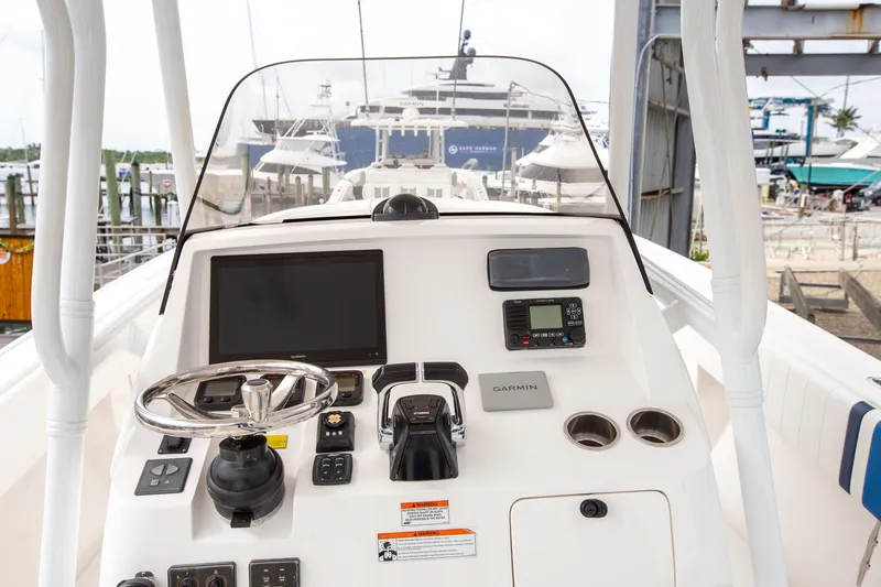 Slide: The Image of Intrepid 32 boat dashboard with navigation equipment, docked at marina, 2011 model. - 9