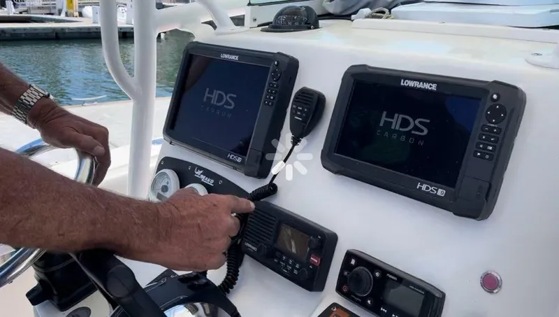 Slide: The Image of Control panel of a 2018 Mako 234 Center Console boat with navigation screens. - 5