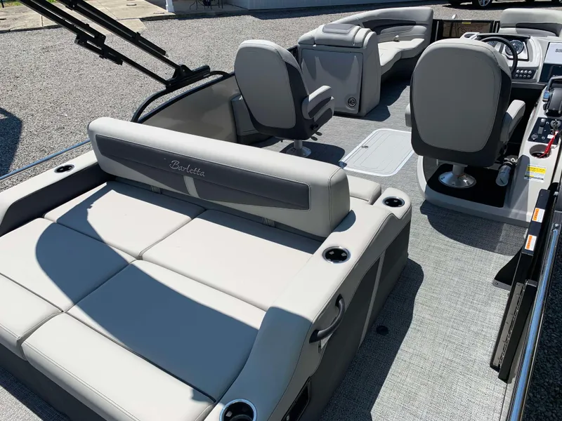 Slide: The Image of 2025 Barletta Cabrio 22UC pontoon boat interior with plush seating and modern design. - 12