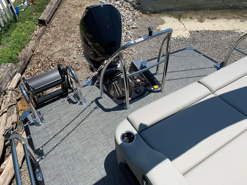 Slide: The Image of 2025 Barletta Cabrio 22UC pontoon boat with sleek seating and modern outboard motor. - 14